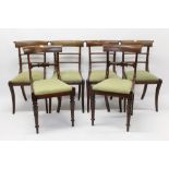 Set of four Regency mahogany bar back dining chairs, each with slip-in seat on sabre legs,
