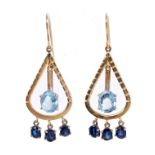 Pair aquamarine and sapphire earrings each suspending an oval mixed cut aquamarine pendant drop