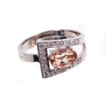 An Imperial Topaz and diamond ring,