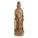 Large antique Chinese carved wood figure of Guanyin, on integral circular plinth, traces of paint,