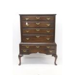 George II oak chest on stand with four long drawers above,