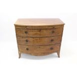 Good George III mahogany bow front chest with brushing slide and three graduated drawers,