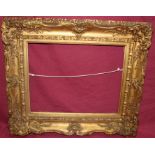 Early 19th century gilt and gesso frame - internal measurements 33cm x 42cm