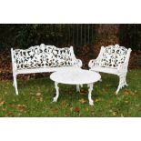 Victorian-style white painted cast aluminium garden bench with arched foliate scroll-back on