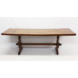 Rare 19th century yew-wood refectory table, the plank top raised on shaped standard ends,