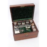 Mid-19th century rosewood toiletry box, extensively fitted with silver plate, lidded glass jars,