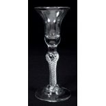 Mid-18th century wine glass with trumpet-shape bowl, swollen air-twist stem on bell-shaped foot,