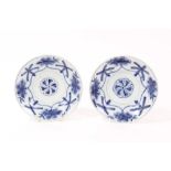Pair late 17th century Chinese blue and white saucer dishes with painted floral mons - seal marks