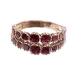 George III garnet ring with a double row of graduated flat cut garnets in foil-backed collet
