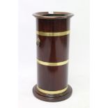 Good mahogany and brass bound cylindrical stick stand with everted rim and tin liner,