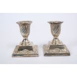 Pair Victorian silver dwarf candlesticks of urn form,