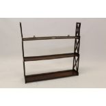 19th century mahogany waterfall hanging shelves, three graduated shelves between lattice supports,