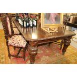 Good and large Victorian carved oak extending dining table,