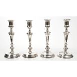 Set of four George V silver candlesticks of tapering form,