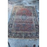 Antique Kashan silk carpet with foliate arabesque ornament on brick red ground in multiple borders