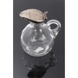 Late Victorian silver mounted glass vinegar jug with hinged cover,