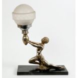 Art Deco silvered table lamp in the form of a sinuous semi-clad female kneeling figure,