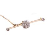 Edwardian diamond cluster bar brooch with a cluster of nine old cut diamonds on a gold knife bar