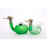 Two Victorian silver mounted liqueur decanters in the form of ducks, with green glass bodies,