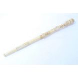 Oriental carved bone telescopic fishing rod, the shaft carved as a bamboo root with insects,