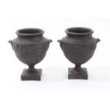 Pair late 18th / early 19th century Wedgwood black Jasper ware urns of bulbous form,