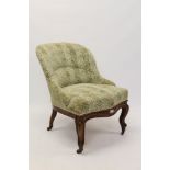 Victorian rosewood tub chair with cream and green print upholstery,