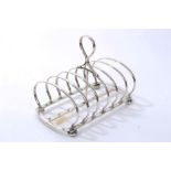 Victorian silver six-division toast rack of hooped form, with central carrying handle,