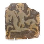 Medieval pottery tile, slip decorated with a horseman, reputedly removed from Muchelney Abbey,