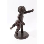 19th century Continental carved fruitwood figure of a putto, 30cm high,