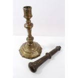 Early 18th century brass candlestick with knopped stem on faceted foot, 25cm high,