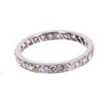 Diamond eternity ring with a full band of twenty-seven brilliant cut diamonds estimated to weigh