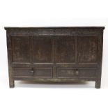 Early 18th century oak mule chest with hinged plank lid enclosing interior with fitted workbox,