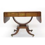 Regency rosewood and brass inlaid sofa table with rounded rectangular drop-leaf top and two flush