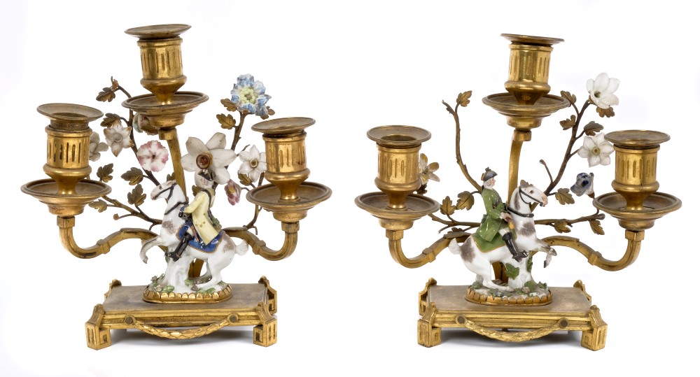 Pair 18th century Meissen miniature equestrian figures, with later gilt metal candelabra mounts,