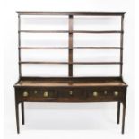 George III oak two-height dresser with open shelved rack,