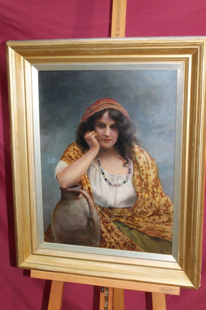 Late 19th / early 20th century Continental School oil on board - portrait of a gypsy girl leaning
