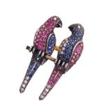 Novelty diamond and gem-set brooch in the form of two love-birds on a perch with pavé-set diamonds,
