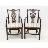 Pair of similar Chippendale-style mahogany elbow chairs, each with pierced vase-shaped splat back,