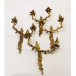 Set of four rococo-style wall sconces, each with twin asymmetric acanthus leaf scrolling branches,