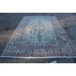 Kasham rug with central concentric medallion and lotus meander foliage with tassel ends 305cm x