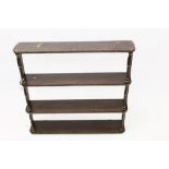 George IV rosewood grained hanging shelves with four D-form shelves between turned supports,