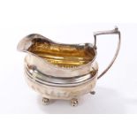 George III silver cream jug of half-fluted form, with angular handle and rectangular base,