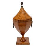 Fine George III inlaid satinwood tea caddy of faceted urn form,