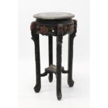 Antique Chinese black lacquered urn stand, circular top with engraved mythical beast ornament,