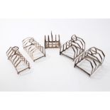 Pair 1930s silver four-division toast racks of hooped form,