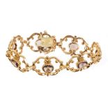 Victorian-style 9ct gold bracelet with seven openwork scroll panels,