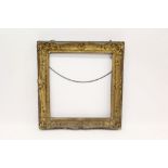 19th century gilt gesso picture frame with C-scroll and shell ornament - internal measurements 54cm