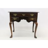 Early 18th century walnut crossbanded lowboy with three drawers above the shaped apron on cabriole