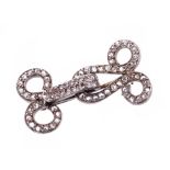 Antique diamond brooch on the form of a clip, set with rose cut diamonds in silver setting on gold,