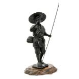 Japanese Meiji bronze figure of a farmer holding a staff, with basket on his belt,